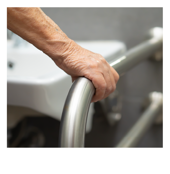 Person using an accessible grab bar for safety