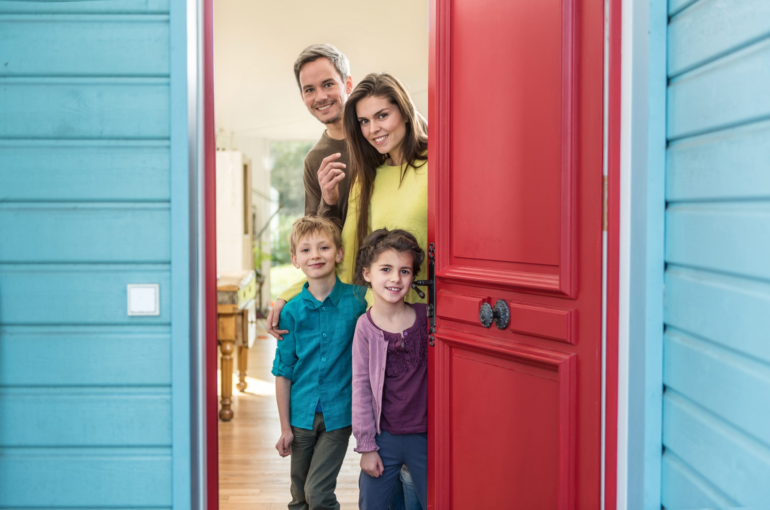 Family Opening Door for Visitors in a home that is visitable